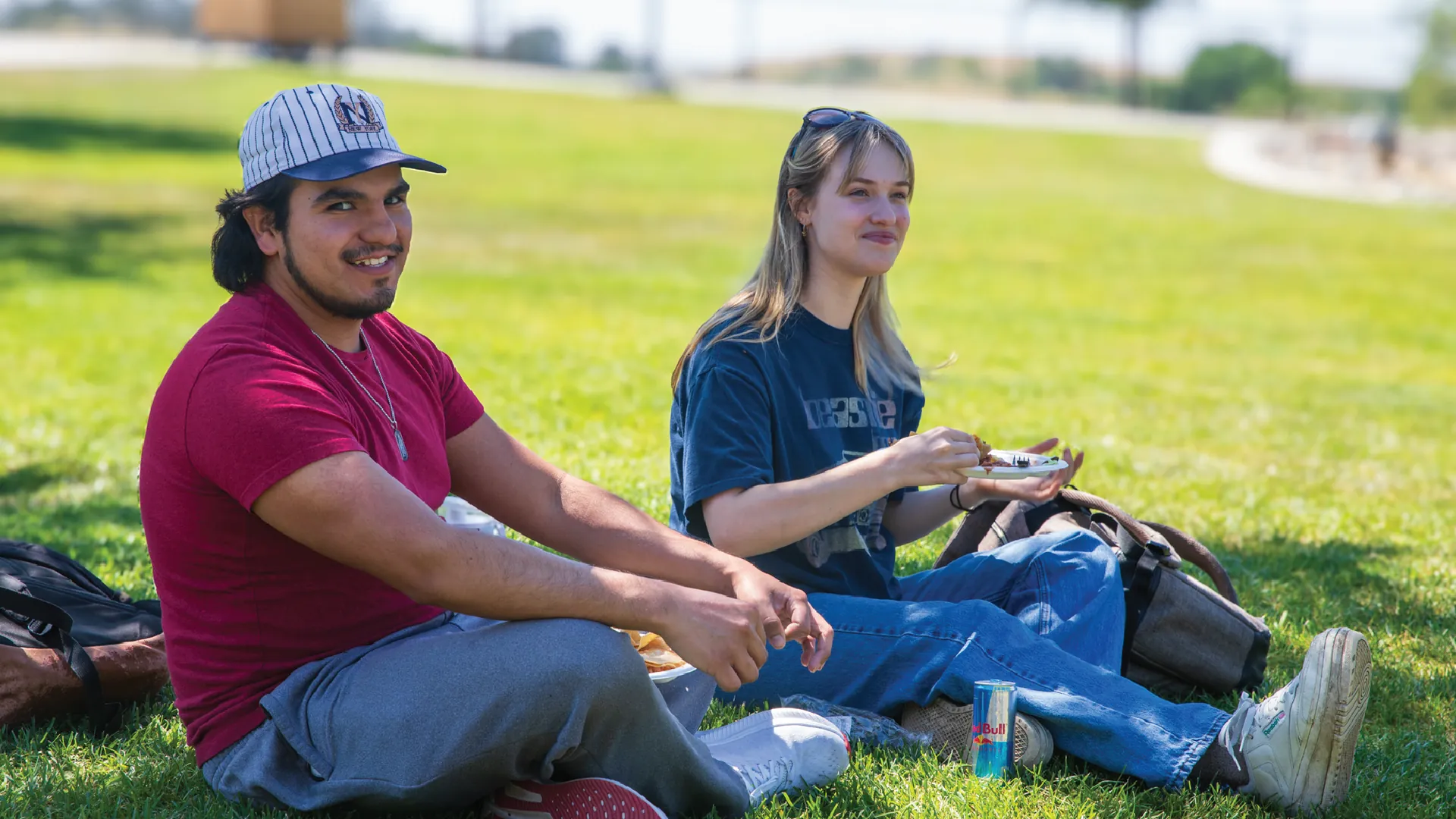 Butte College students sit on the lawn and eat together