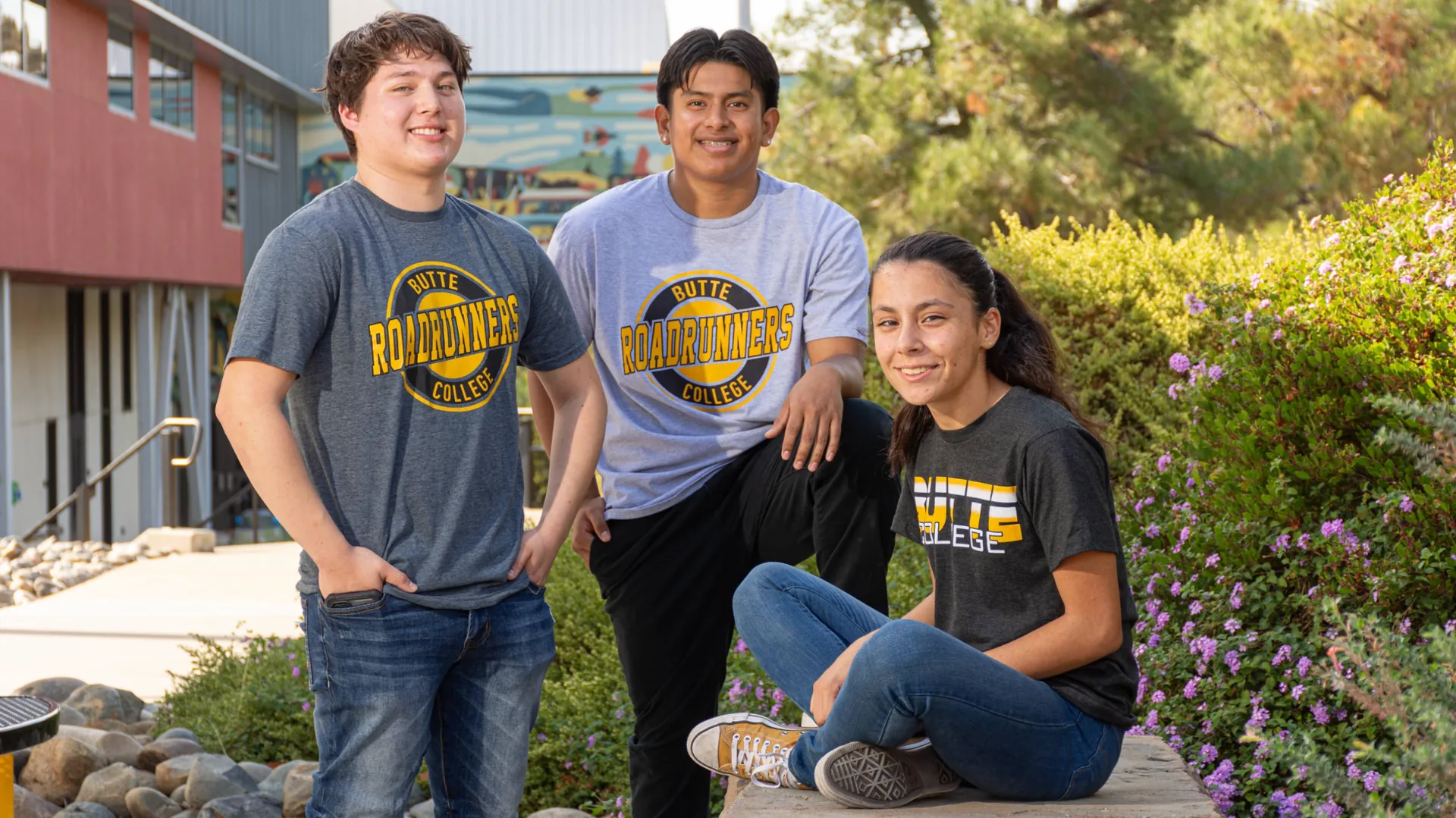 Three Butte College Students gather on campus