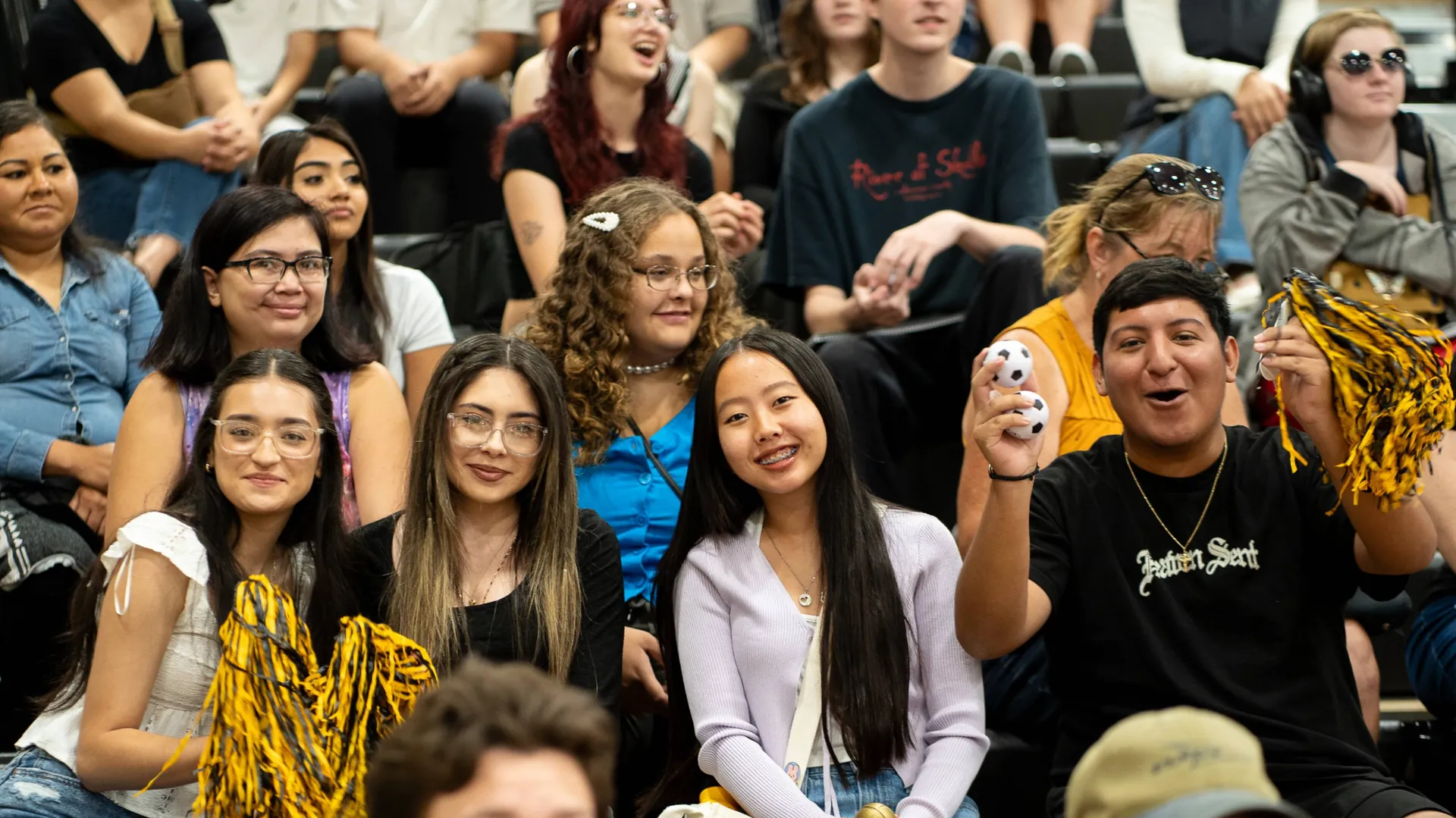 Butte College Students gather on bleachers to cheer