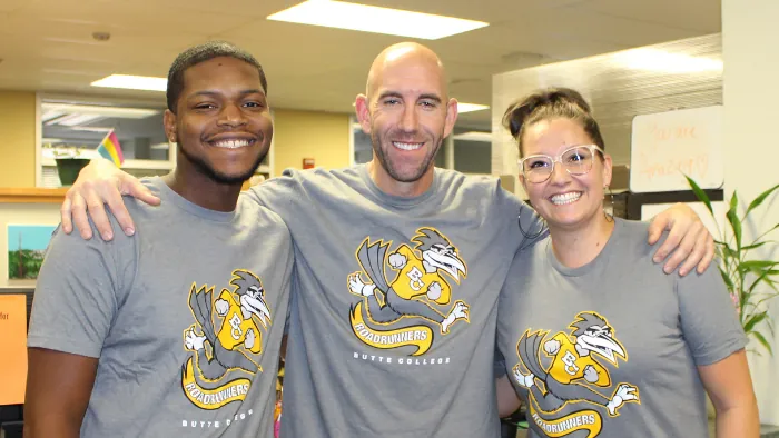 Three Butte College Employees staff wearing roadrunner t shirts