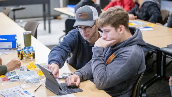 Butte College engineering students work on a robot