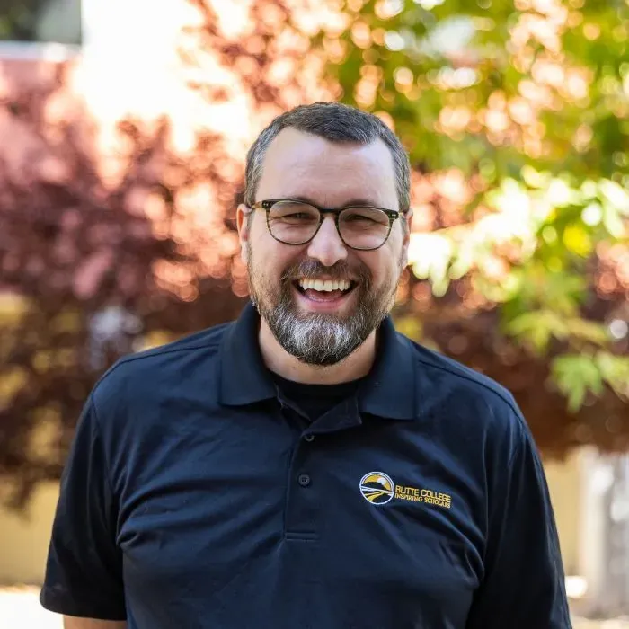 Butte College Eddie stands outside of inspiring scholars