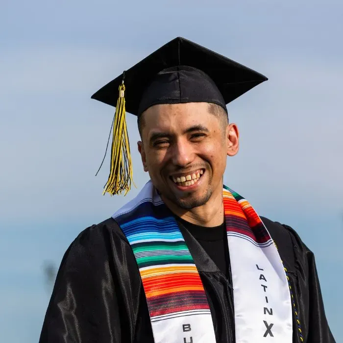 Butte College Rising scholar graduate in his cap and gown