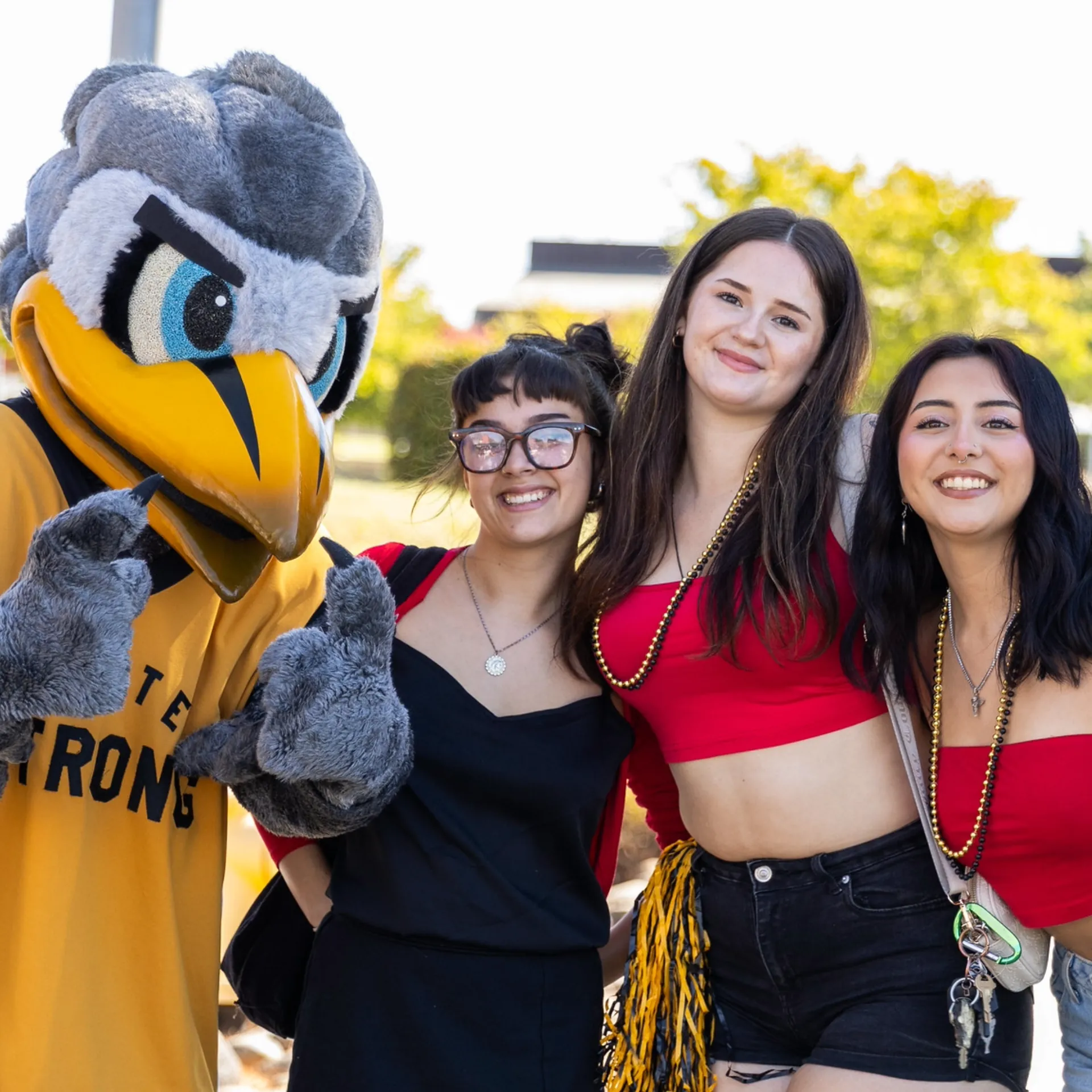 Butte College Students pose with Dash Mascot at campus event
