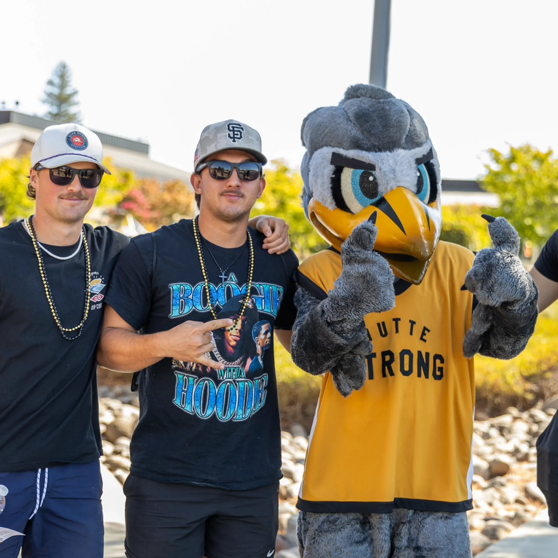 Butte College Students pose with Dash Mascot at campus event