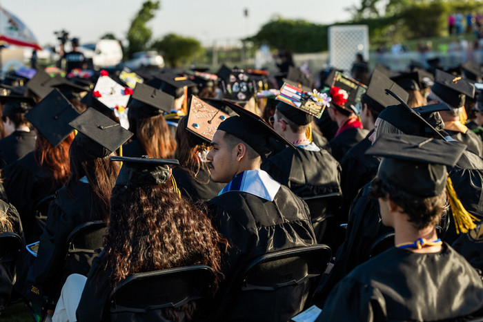 graduates-seated-at-commencement-with-view-of-caps.jpg