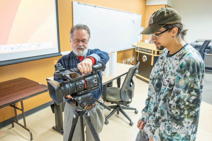 av-student-works-with-instructor-to-set-up-camera