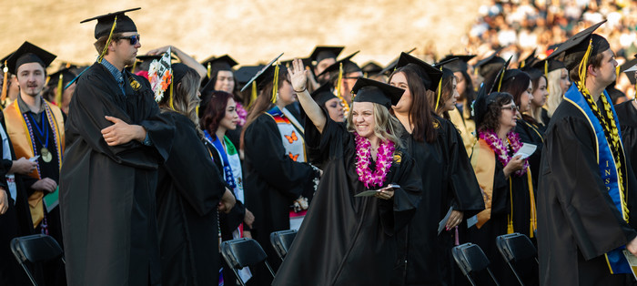 grads-wave-to-crowd-at-commencement