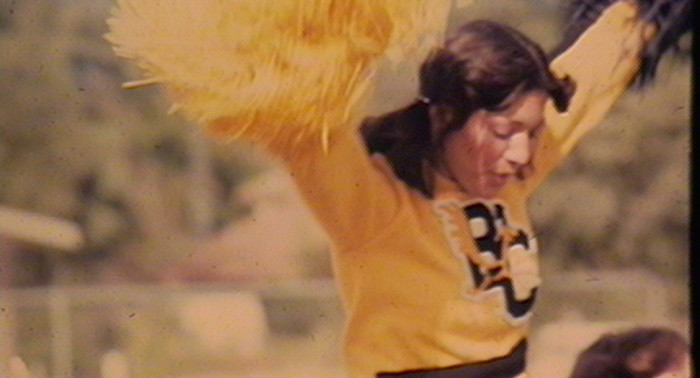 butte-college-history-cheerleader-in-yellow-responsive-hero
