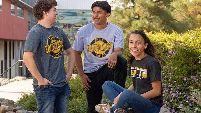 Three Butte College Students gather on campus in butte college t shirts