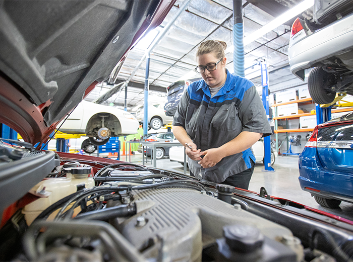 A Butte College student works on a vehicle at the skyway center