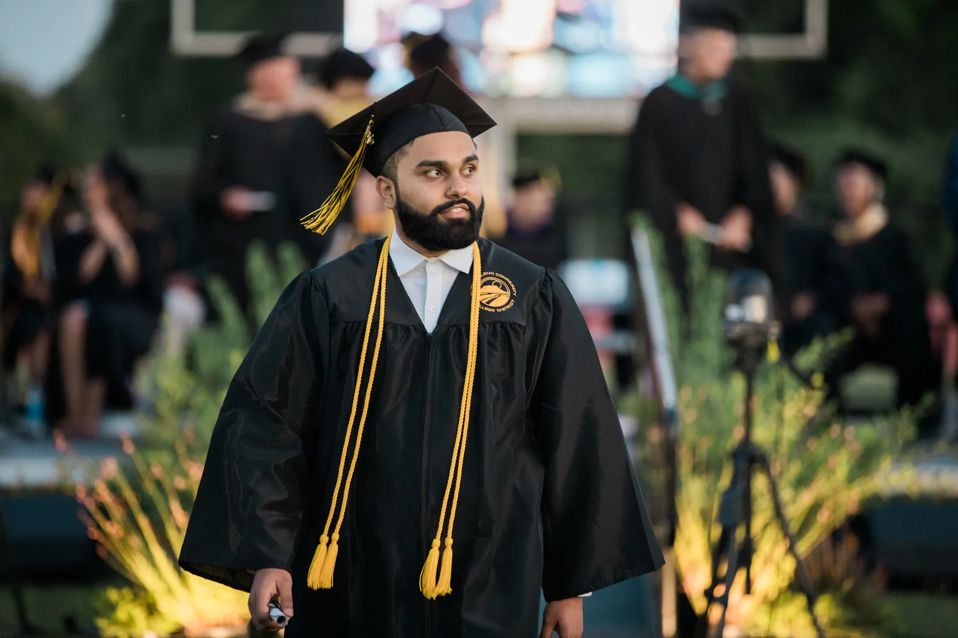 Butte College Graduate walks toward stage at commencement ceremony