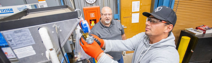 Butte College Industrial Technology, Agriculture & related fields COI student works on hvac system