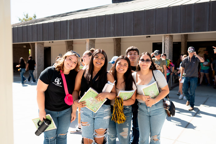 group-of-students-gather-on-campus