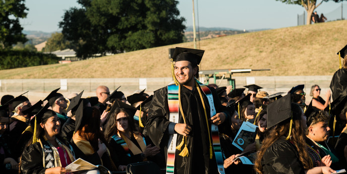 latinx-grad-stands-in-celebration-at-commencement