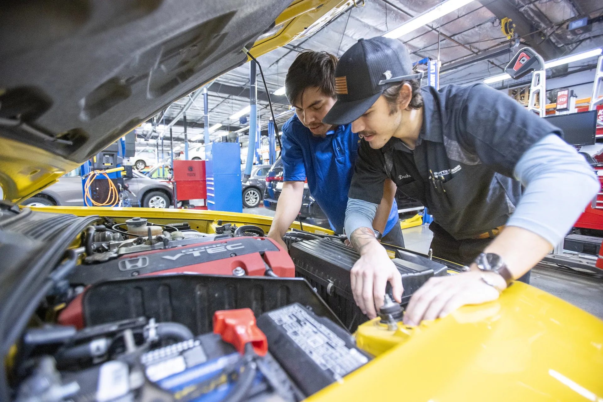 Butte College Automotive Program Student works under the hood