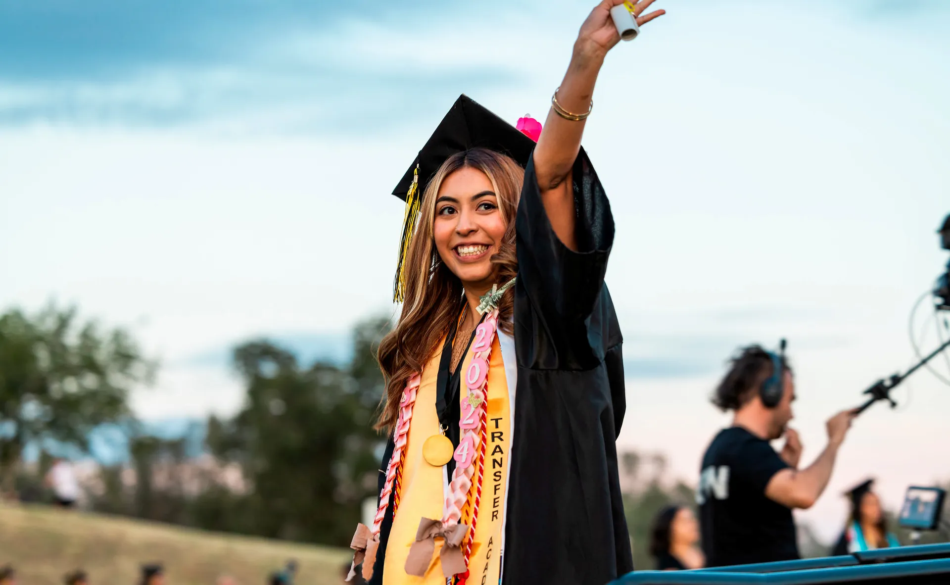 Bute College Graduate stands up to cheet at commencement ceremony