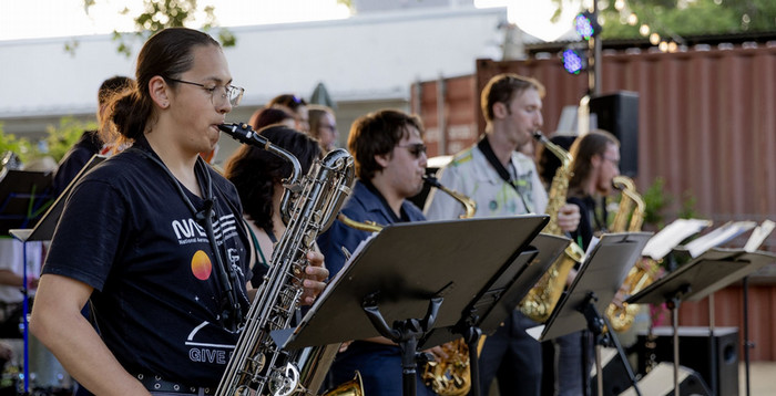music-student-performs-saxaphone-at-campus-event.