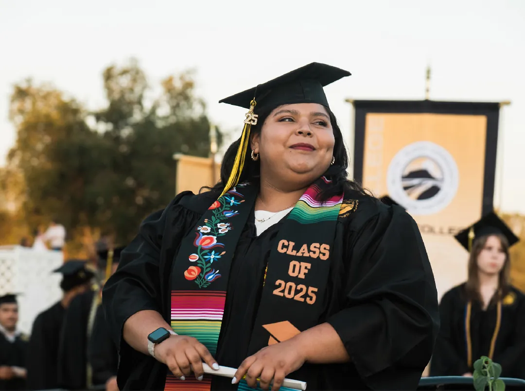 Butte College Graduate proudly receives her diploma at commencement ceremony
