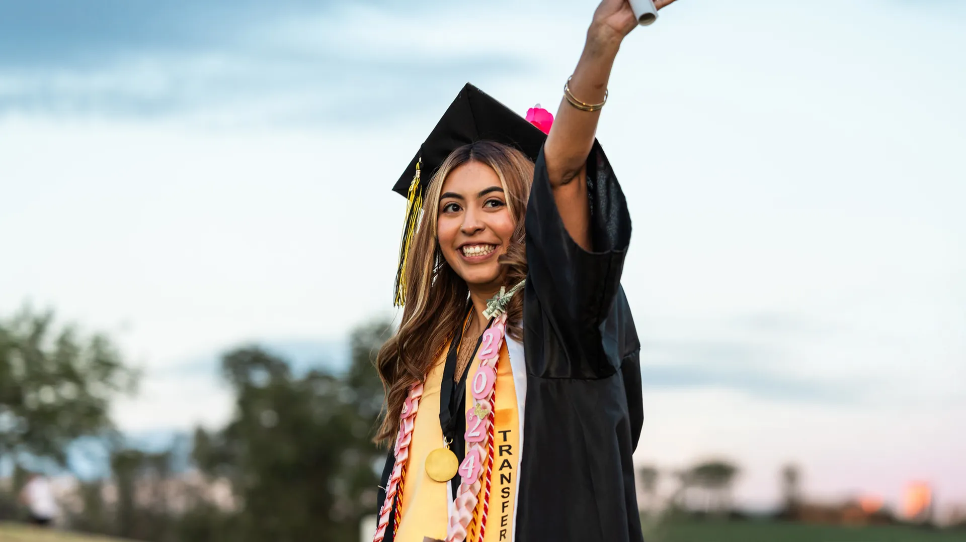 Butte College Graduate waves at commencement ceremony