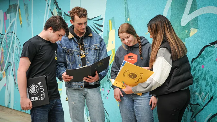 Students compare notes on campus