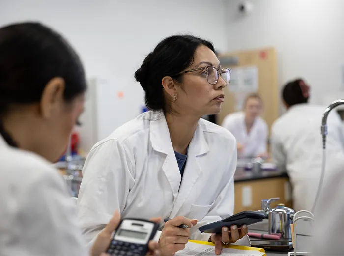 Butte College Student concentrates on the assignment in the science lab