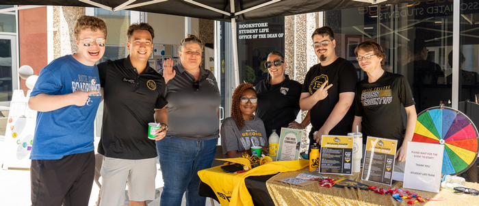 Students pose together at a campus event.