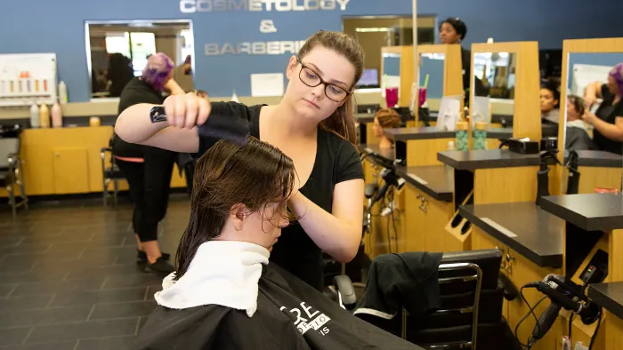 Butte College cosmetology and barbering Student performs services