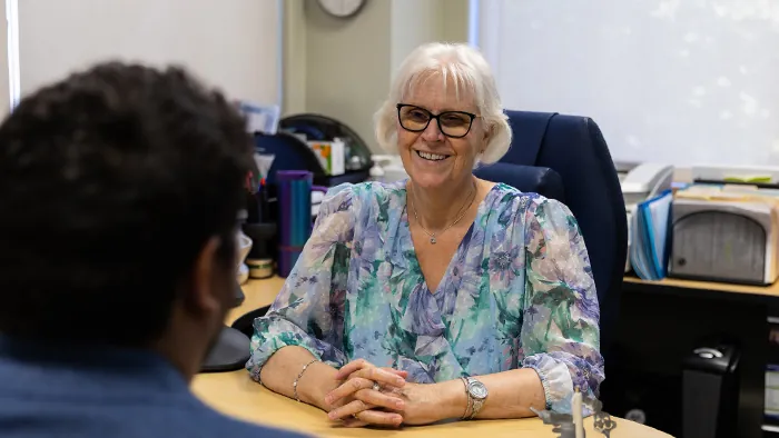 Butte College main campus services employee helps student