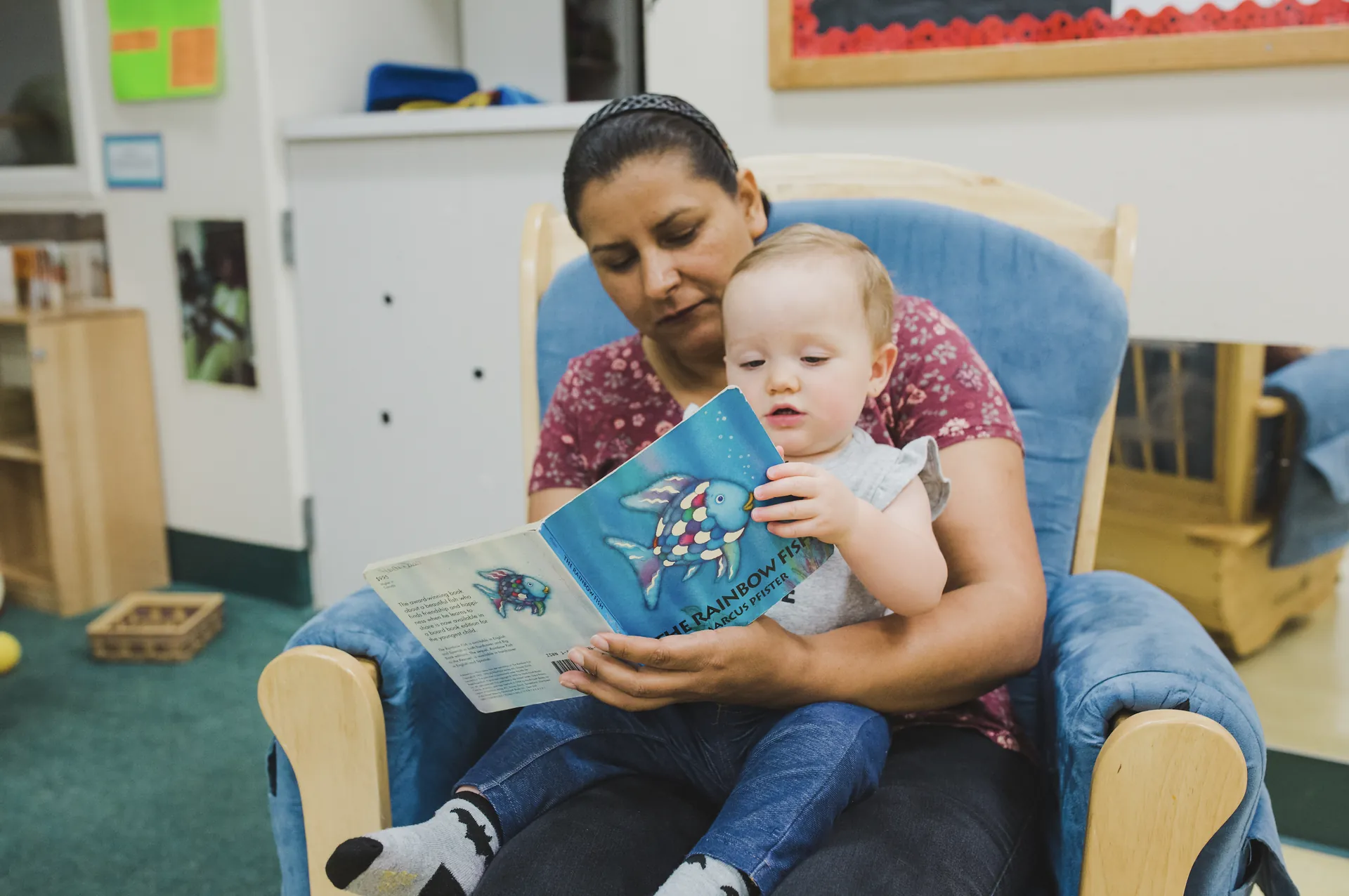 Butte College Student resources basic needs childcare center worker reads to baby