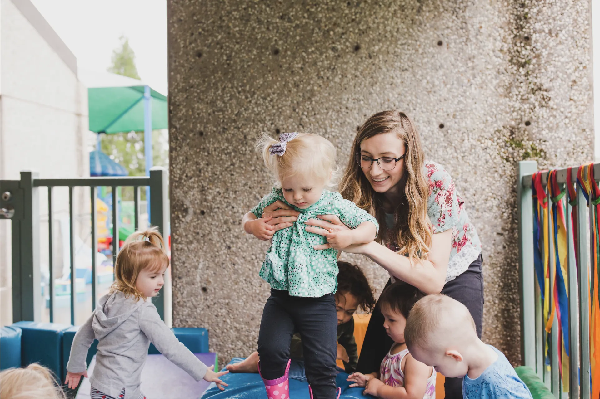 Butte College Student resources basic needs childcare center worker plays with toddlers