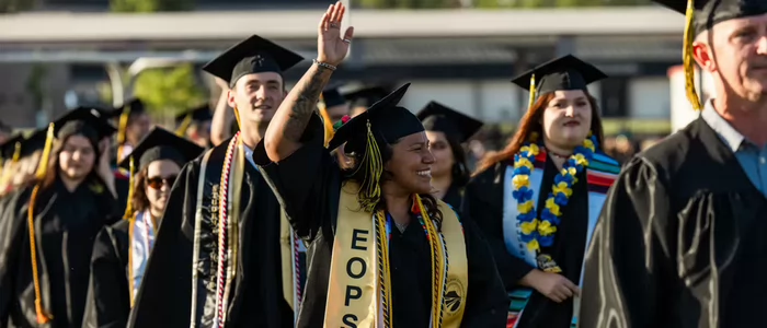 eops-female-graduate-waiving