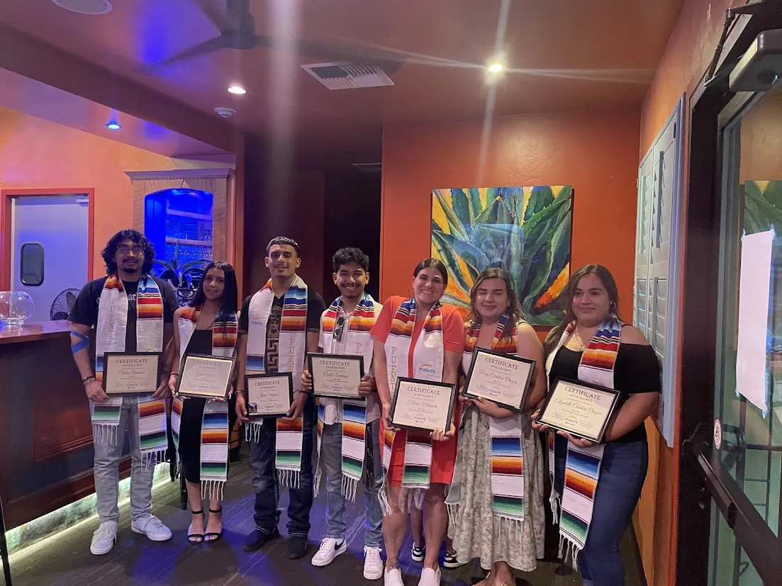 Butte College Puente Students present certificates at transfer celebration