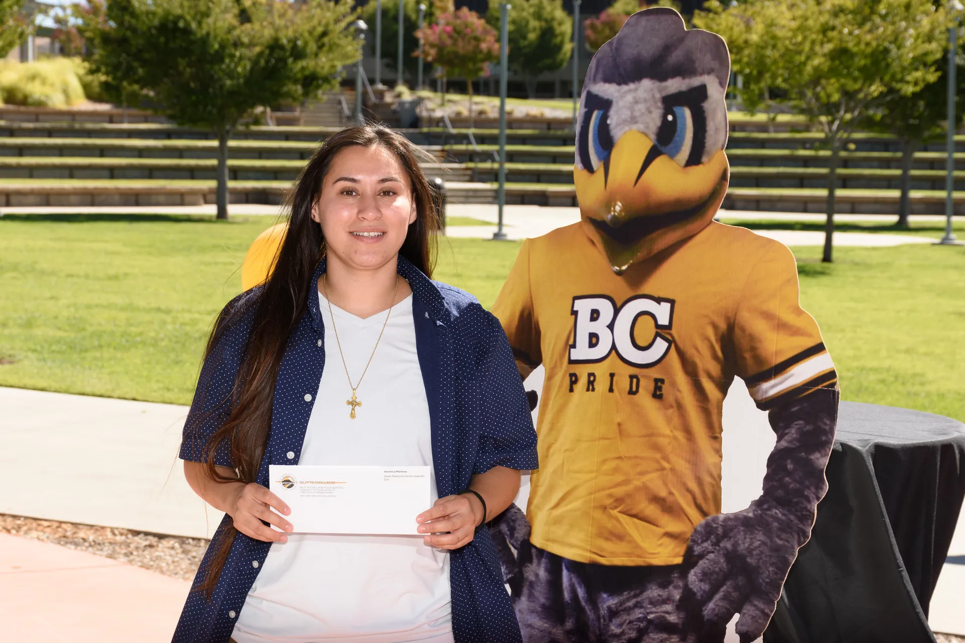 Butte College rising scholars youth justice Student poses with Dash Mascot